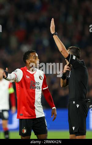 ROTTERDAM, NETHERLANDS - SEPTEMBER 19: Quinten Timber (Feyenoord Rotterdam) and referee Irfan Peljto during the UEFA Champions League 2023/2024 - Grou Stock Photo