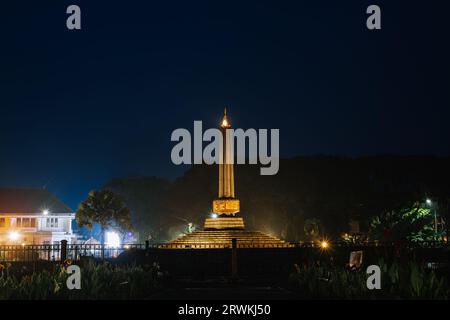 Tugu Malang at night. Main landmark and tourist icon of Malang City in East Java, Indonesia. Malang Town Square. Stock Photo