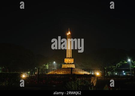 Tugu Malang at night. Main landmark and tourist icon of Malang City in East Java, Indonesia. Malang Town Square. Stock Photo