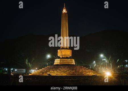 Tugu Malang at night. Main landmark and tourist icon of Malang City in East Java, Indonesia. Malang Town Square. Stock Photo