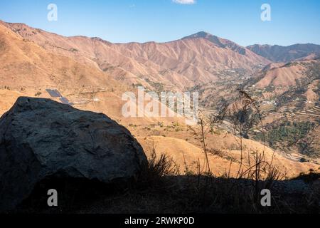 Expansive Himalayan valleys in Uttarakhand, with a prominent foreground rock, Pattarkhol, Tehri, India. Stock Photo
