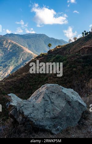 Expansive Himalayan valleys in Uttarakhand, with a prominent foreground rock, Pattarkhol, Tehri, India. Stock Photo