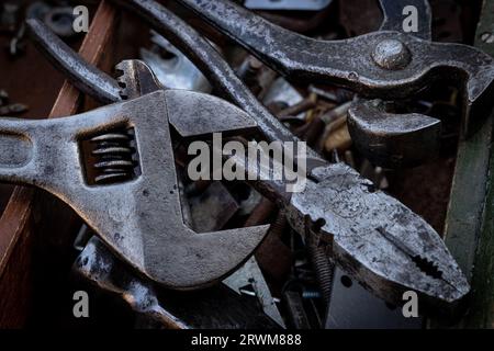 Old work tools lie on a wooden tool box Stock Photo
