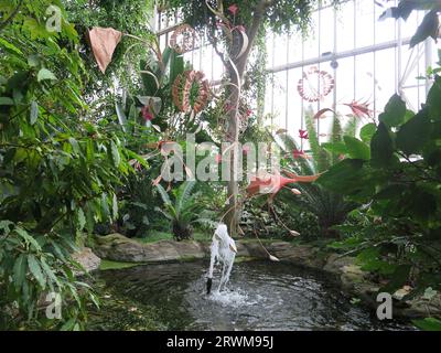 Suspended sculptures by Indian artist Ranjani Shettar in 'Cloud Songs on the Horizon' hanging above the exotic plants in the Barbican Conservatory. Stock Photo