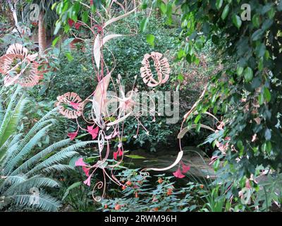 Suspended sculptures by Indian artist Ranjani Shettar in 'Cloud Songs on the Horizon' hanging above the exotic plants in the Barbican Conservatory. Stock Photo