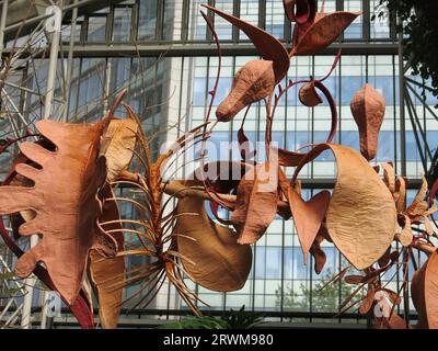 Suspended sculptures by Indian artist Ranjani Shettar in 'Cloud Songs on the Horizon' hanging above the exotic plants in the Barbican Conservatory. Stock Photo