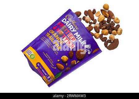 Bag of Cadbury Dairy Milk Fruitier & Nuttier Orange Trail Mix a delicious mix of fruits, nuts & Cadbury Dairy Milk orange buttons isolated on white Stock Photo