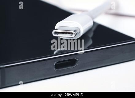 USB Type C cable, Type C port connector charger on white background, power charger port of mobile phone, Smartphone charger technology concept. Stock Photo