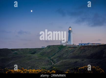 Flamborough Lighthouse at dusk (pre 2022), just after the light was  switched on, ready for the night.. Stock Photo