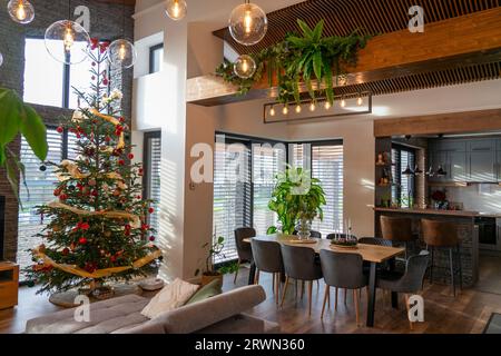 chistmas tree holiday celebration in a modern home with natural vibe . Stock Photo