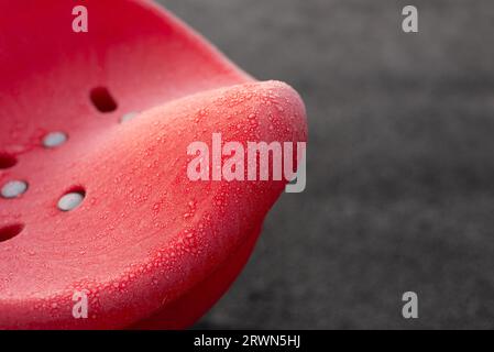 Red child's spinning seat in frozen playground Stock Photo