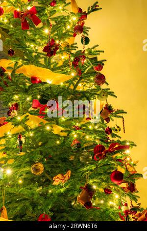 beautifully decorated illuminated christmas tree on crtistmas eve . Stock Photo