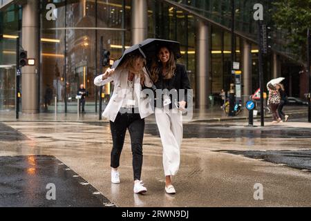 People walk through the rain and wet weather in Victoria, London. Picture date: Wednesday September 20, 2023. Stock Photo
