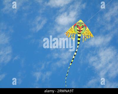 Colorful kite in clear sky Stock Photo