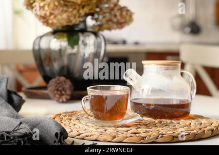 Autumn tea at the modern kitchen. Still life in home interior. Close up. Tea time, cozy atmosphere. Stock Photo