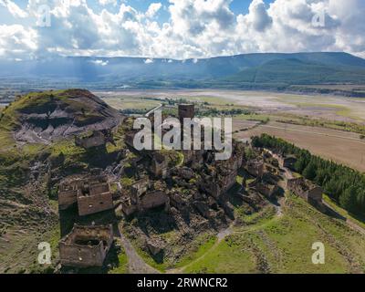 Aerial drone photo of the abandoned ghost town named Esco. Esco is located next to lake Aragon in Northern Spain. Stock Photo