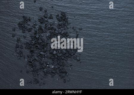 Black Hawaiian Lava Salt, volcanic lava sea salt made from sea water and blended with deactivated charcoal, used for spice and condiment in cooking on Stock Photo