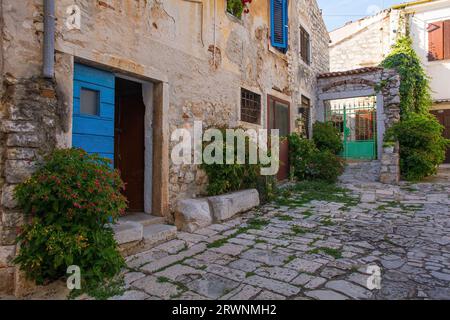 A quiet back street in the historic centre of the medieval coastal town of Rovinj in Istria, Croatia Stock Photo