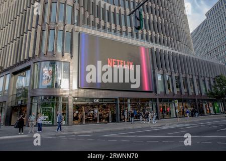 Berlin, Germany. 20th Sep, 2023. Illuminating the urban landscape, a billboard showcases a Netflix advertisement on September 20, 2023, highlighting the streaming giant's pervasive influence in a nation confronting economic headwinds. (Photo by Michael Kuenne/PRESSCOV/Sipa USA) Credit: Sipa USA/Alamy Live News Stock Photo