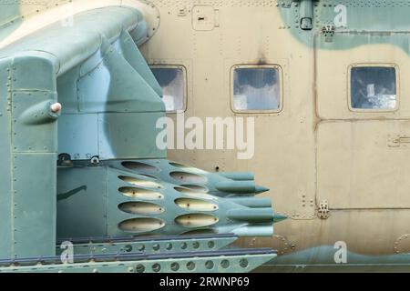 Old Soviet-made camouflage Mi-24 military helicopter rocket pods Stock Photo