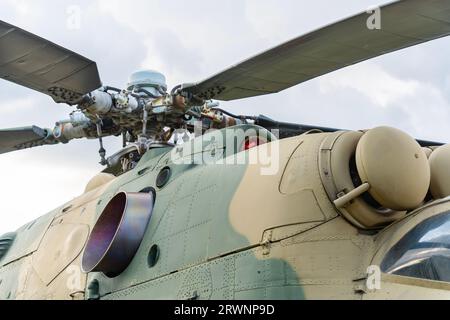 Old Soviet-made camouflage Mi-24 military helicopter propeller Stock Photo