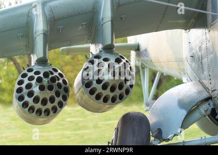 Old Soviet-made camouflage Mi-24 military helicopter rocket pods Stock Photo