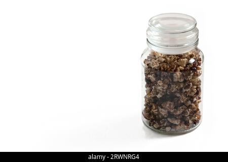 Studio shot of a jar of chocolate popcorn on white background. Stock Photo