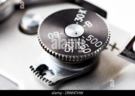 Mechanical shutter speed switch on the old vintage camera Stock Photo