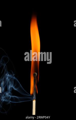 Burning match with smoke on black background Stock Photo