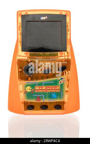 Winneconne, WI - 12 August 2023:  A package of Pac Man classic hand held video game on an isolated background Stock Photo