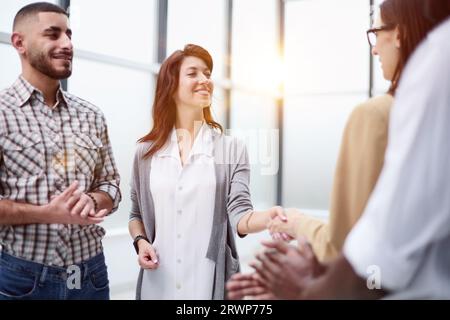 Laughing multiethnic business people talking in the office Stock Photo ...