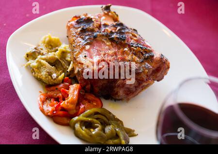 Grilled pork knuckle with vegetables Stock Photo