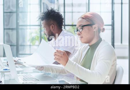 A group of young students are being trained on a computer in a training course Stock Photo
