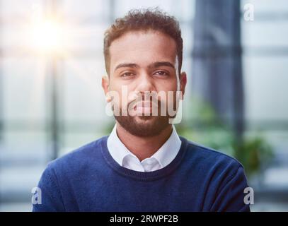 Smiling millennial confident black guy posing for photo, looking at camera Stock Photo