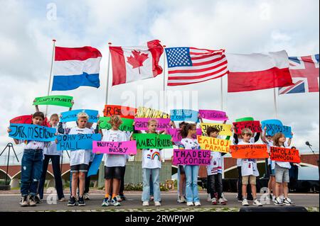 Children are seen holding the names of the American soldiers who died in the operation. At the Waal Crossing Memorial (Waaloversteek-monument), a solemn ceremony took place to commemorate the heroic crossing of the Waal River by American soldiers of the 82nd Airborne Division, during the Operation, now 78 years ago. The ceremony counted with the presence of the Mayor of Nijmegen, Hubert Bruls, and the 82nd Airborne Division paratroopers from the USA. Although Operation Market Garden was unsuccessful, the Americans and British were able to liberate Nijmegen, the Netherlands' oldest city, after Stock Photo