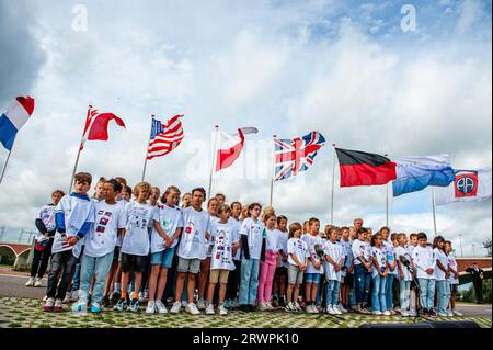 Children are seen singing the American national anthem. At the Waal Crossing Memorial (Waaloversteek-monument), a solemn ceremony took place to commemorate the heroic crossing of the Waal River by American soldiers of the 82nd Airborne Division, during the Operation, now 78 years ago. The ceremony counted with the presence of the Mayor of Nijmegen, Hubert Bruls, and the 82nd Airborne Division paratroopers from the USA. Although Operation Market Garden was unsuccessful, the Americans and British were able to liberate Nijmegen, the Netherlands' oldest city, after fierce fighting. Stock Photo