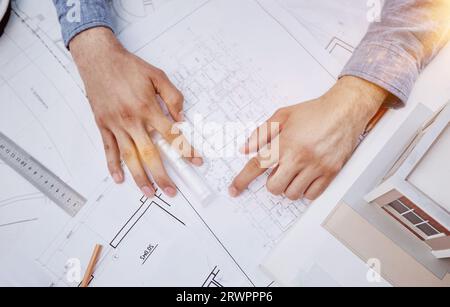 Young handsome architect engineer working on design plan Stock Photo