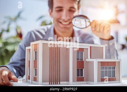 house searching, colorful mini model homes being viewed through magnifying glass, 3d render illustration Stock Photo