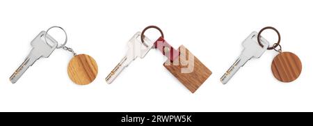Set of keys with wooden key chains isolated on white Stock Photo
