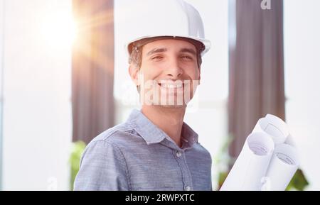 Portrait of an engineer in a hard hat posing for the camera Stock Photo