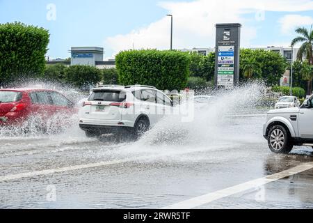 Miami Hialeah Florida,W 16th Avenue,flooding after heavy rain,climate change,vehicles cars splashing Stock Photo