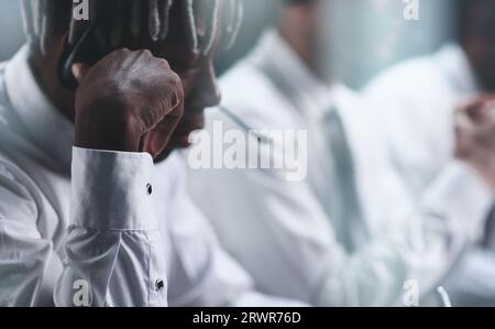Black sales agents wearing a headset while working in a call centre. Stock Photo