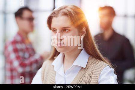 Woman reading important business documents sitting at the table in the office Stock Photo