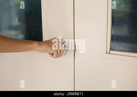 Woman opening or closing the door with her hand Stock Photo