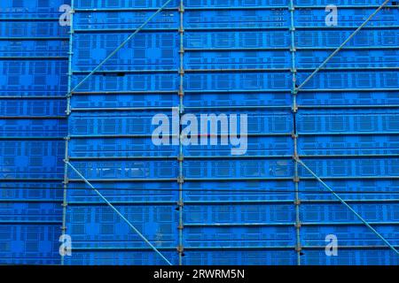 Scaffolding blue colour showing abstract square patterns on building exterior in Melbourne city, Australia. Stock Photo