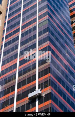 Window cleaning and skyscraper maintenance showing an office building glass exterior view in Melbourne city, Australia. Stock Photo