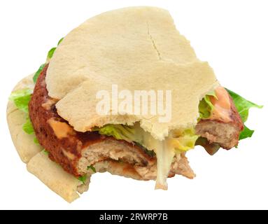 Pitta bread with patty as sandwich hafl eaten Stock Photo