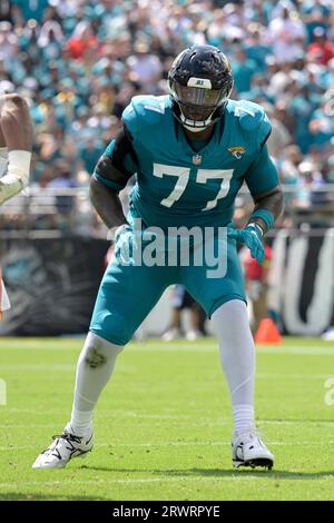 Jacksonville Jaguars offensive tackle Anton Harrison (76) puts on his helmet  before a drill during an NFL football practice, Monday, June 12, 2023, in  Jacksonville, Fla. (AP Photo/John Raoux Stock Photo - Alamy