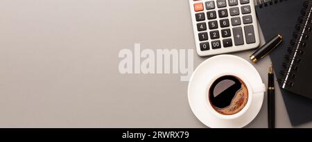 Top view of Gray stylish workplace with smartphone and office supplies on black leather table background . High quality photo Stock Photo
