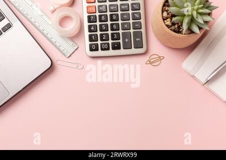 Working with Laptop computer,Hot coffee and cactus copy space on pink table background.Top view,Flat lay,style Minmal workspace,business Concept. High Stock Photo
